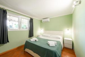 Postel nebo postele na pokoji v ubytování Villa Collina dei Pini