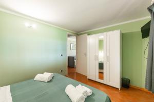Postel nebo postele na pokoji v ubytování Villa Collina dei Pini