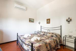 Postel nebo postele na pokoji v ubytování Villa Collina dei Pini