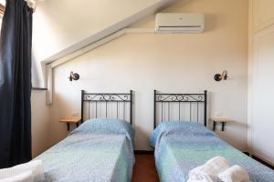 Postel nebo postele na pokoji v ubytování Villa Collina dei Pini