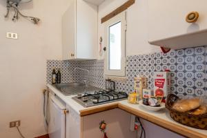 Kuchyň nebo kuchyňský kout v ubytování Villa Collina dei Pini