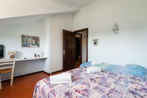 Postel nebo postele na pokoji v ubytování Villa Collina dei Pini