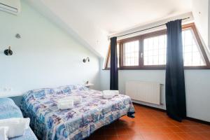 Postel nebo postele na pokoji v ubytování Villa Collina dei Pini