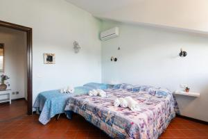 Postel nebo postele na pokoji v ubytování Villa Collina dei Pini