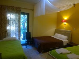 
Ένα ή περισσότερα κρεβάτια σε δωμάτιο στο Το Χάνι του Ζεμενού

