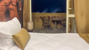 Postel nebo postele na pokoji v ubytování Moon Pyramids Inn