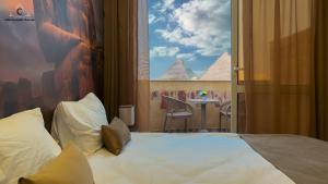 Postel nebo postele na pokoji v ubytování Moon Pyramids Inn