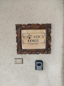 a sign on the wall of an institute of coffee at L'Antica Corte in Mongardino +27 photos