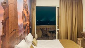 Postel nebo postele na pokoji v ubytování Moon Pyramids Inn