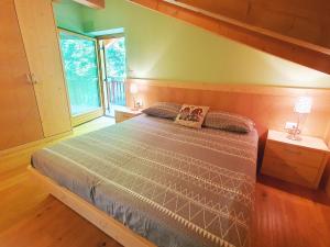 Ένα ή περισσότερα κρεβάτια σε δωμάτιο στο Chalet di Mario - Alpine Stay Apartments