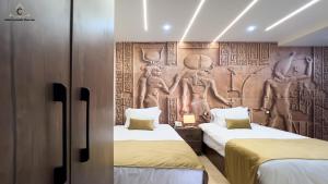 Postel nebo postele na pokoji v ubytování Moon Pyramids Inn