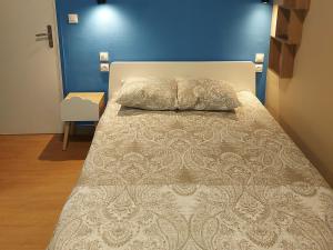 Postel nebo postele na pokoji v ubytování Ardenn'Hotel