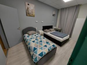 Postel nebo postele na pokoji v ubytování Ardenn'Hotel