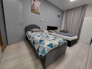 Postel nebo postele na pokoji v ubytování Ardenn'Hotel