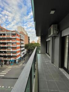 a balcony of a building with a view of a street at Montevideo Suite in Rosario
