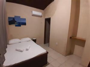 Ένα ή περισσότερα κρεβάτια σε δωμάτιο στο Casa Astral - Praia da Pipa - Casa do Gerson