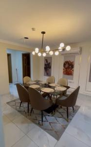 a dining room with a table and chairs at Summit Residence in Accra