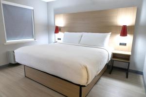 Postel nebo postele na pokoji v ubytování Atrea Inn Amarillo