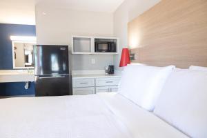 Postel nebo postele na pokoji v ubytování Atrea Inn Amarillo