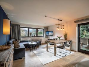 TV a/nebo společenská místnost v ubytování Appartement Herliana by NV-Appartements