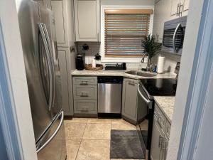 a kitchen with a stainless steel refrigerator at MDKD Private Place in Decatur