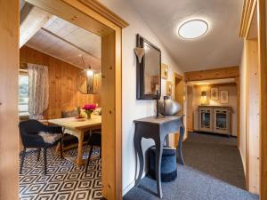 a dining room and kitchen in a tiny house at Teresa II Dachgeschosswohnung mit 2 Schlafzimmern - by NV-Appartements in Kirchberg in Tirol +8 photos