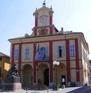 a building with a clock tower on top of it at Hotel Residence Vigone in Vigone