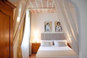 Postel nebo postele na pokoji v ubytování BELVEDERE MONFERRATO Relais & Wellness + 37 fotografií