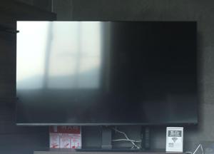 A television and/or entertainment centre at プラフィーノリゾートヴィラ