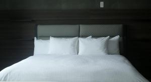 A bed or beds in a room at プラフィーノリゾートヴィラ