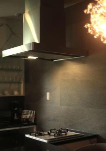 A kitchen or kitchenette at プラフィーノリゾートヴィラ