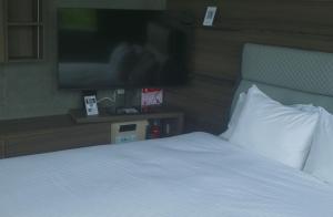A bed or beds in a room at プラフィーノリゾートヴィラ