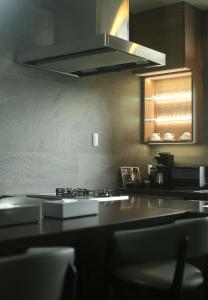 A kitchen or kitchenette at プラフィーノリゾートヴィラ