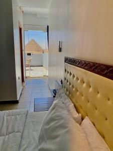 Vuode tai vuoteita majoituspaikassa Anubis Pyramids View