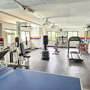 a gym with a lot of equipment in a room at Omni Suites 2Bedroom in Bangkok