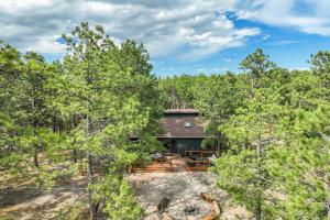 an aerial view of a house in the woods at Buckskin Hideaway Hiking & Biking Trails BBQ in Monument
