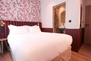 Postel nebo postele na pokoji v ubytování Rosa Hotel