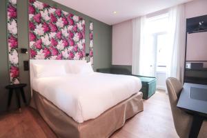 Postel nebo postele na pokoji v ubytování Rosa Hotel