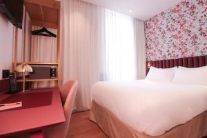 Postel nebo postele na pokoji v ubytování Rosa Hotel