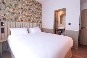 Postel nebo postele na pokoji v ubytování Rosa Hotel