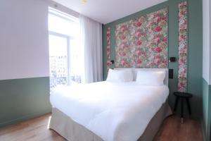 Postel nebo postele na pokoji v ubytování Rosa Hotel