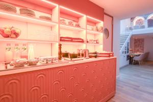 Kuchyň nebo kuchyňský kout v ubytování Rosa Hotel