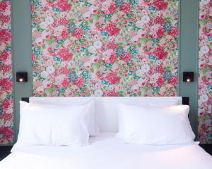 Postel nebo postele na pokoji v ubytování Rosa Hotel