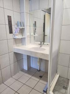 a bathroom with a sink and a mirror at Sun Fog Hotel in Yuchi