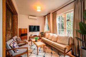 TV a/nebo společenská místnost v ubytování Cosy 3 Bedroom Villa in Freeman's Bay