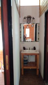 a bathroom with a sink and a mirror at Cabañas Pa ke mas in Punta Indio +39 photos