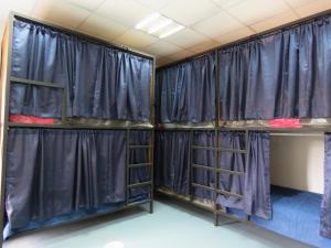 a room with black curtains and bunk beds at Hostal Centro Histórico in Oaxaca City