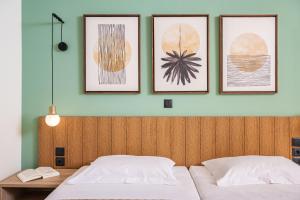 A bed or beds in a room at Emily Hotel