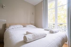 Posteľ alebo postele v izbe v ubytovaní Relaxing Studio Apartment in the Heart of Paris