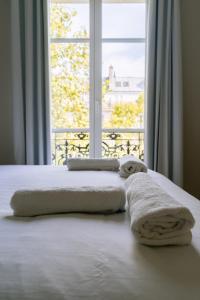 Posteľ alebo postele v izbe v ubytovaní Relaxing Studio Apartment in the Heart of Paris
